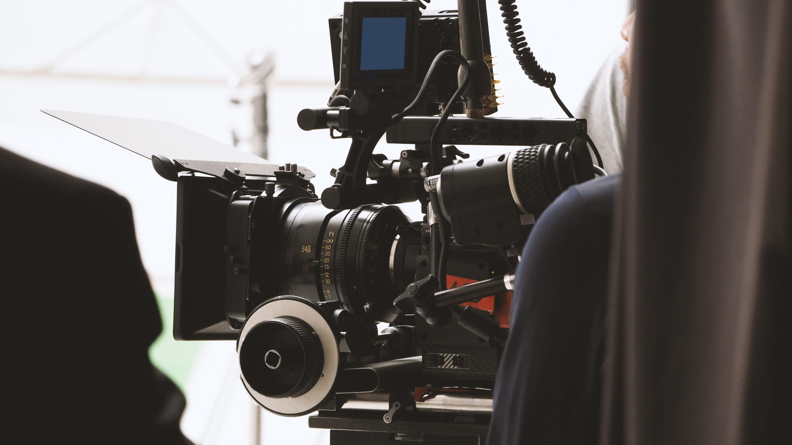 Behind the shooting or filming video movie production Behind the shooting or filming video movie and film production crew team setting up camera on tripod and professional equipment in studio for offline tv commercial or online web film recording.